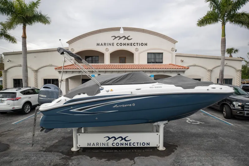 Slide: The Image of 2023 Hurricane SunDeck 2200 OB boat displayed at Marine Connection dealership. - 5