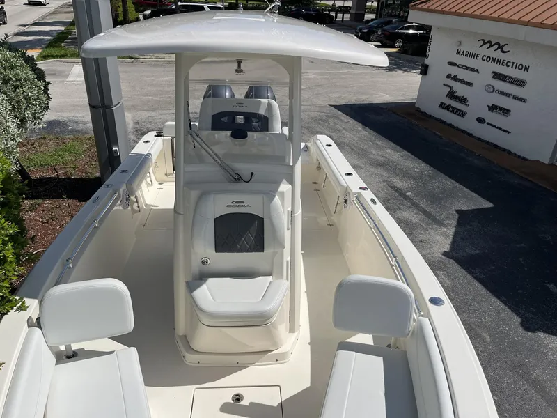 Slide: The Image of 2024 Cobia 240 CC boat with center console and seating, displayed at Marine Connection. - 18