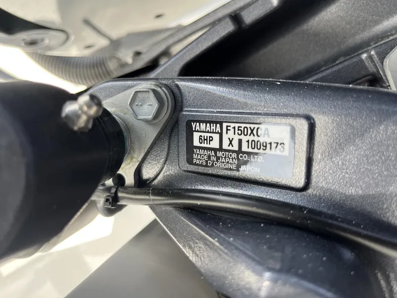 Slide: The Image of Yamaha F150XCA engine label on 2024 Cobia 240 CC boat. - 9
