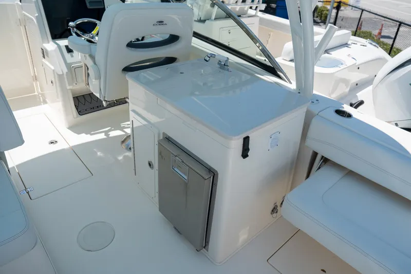 Slide: The Image of 2024 Cobia 280 DC boat interior with seating and helm station. - 18