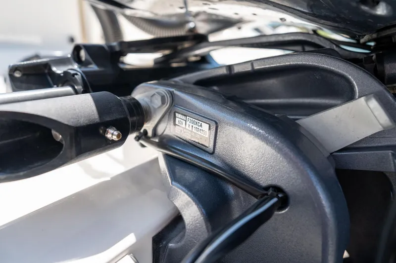 Slide: The Image of Close-up of Yamaha F200XCA engine on 2024 Cobia 280 DC boat. - 41
