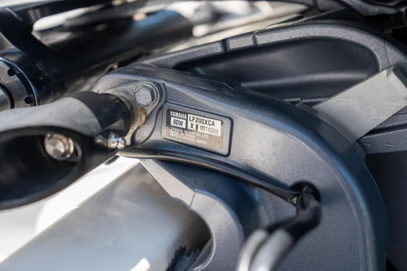 Slide: The Image of Close-up of Yamaha LF200XCA engine part on 2024 Cobia 280 DC boat. - 42