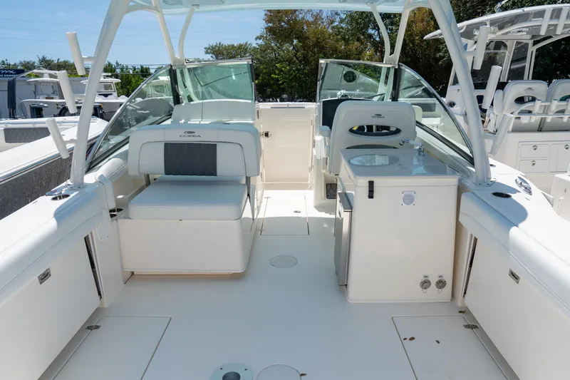 Slide: The Image of 2024 Cobia 280 DC boat interior with seating and helm station. - 8