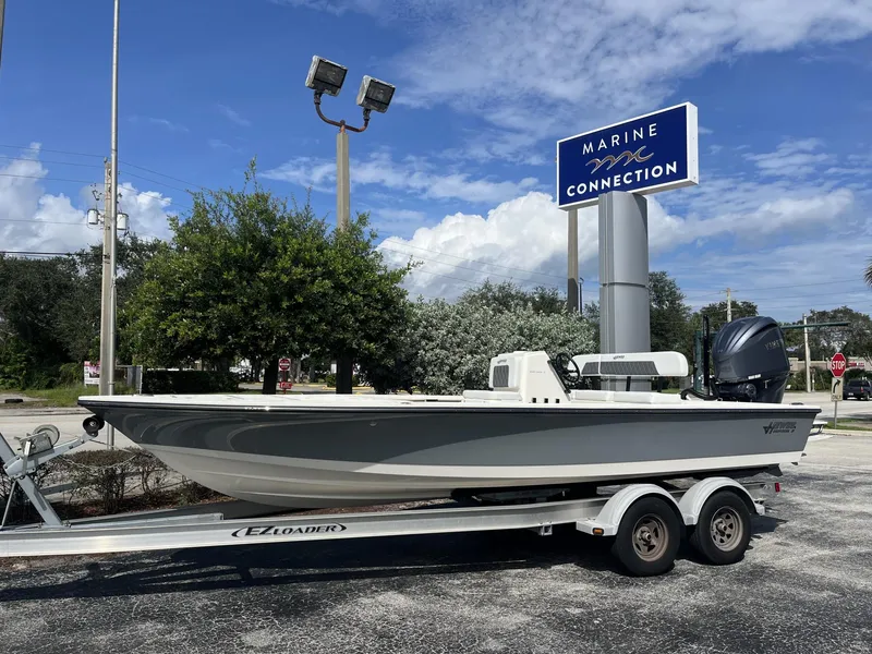 Slide: The Image of 2024 Hewes Redfisher 21 boat on trailer at Marine Connection dealership. - 1