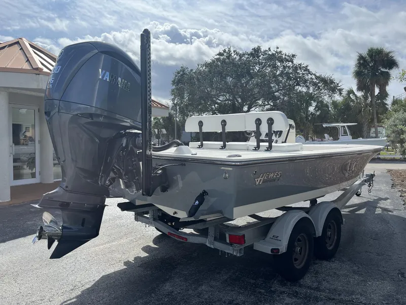 Slide: The Image of 2024 Hewes Redfisher 21 boat on trailer with Yamaha outboard motor. - 6
