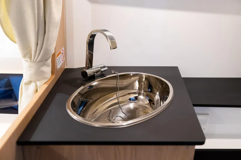 Slide: The Image of Stainless steel sink in 2024 Quarken 27 T-Top V2 boat interior. - 24