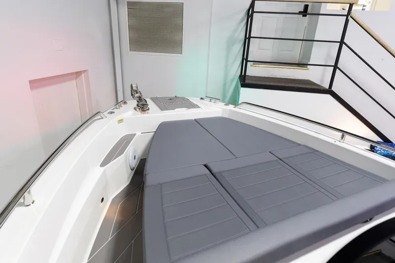 Slide: The Image of 2024 Quarken 27 T-Top V2 boat interior with gray seating and modern design. - 25