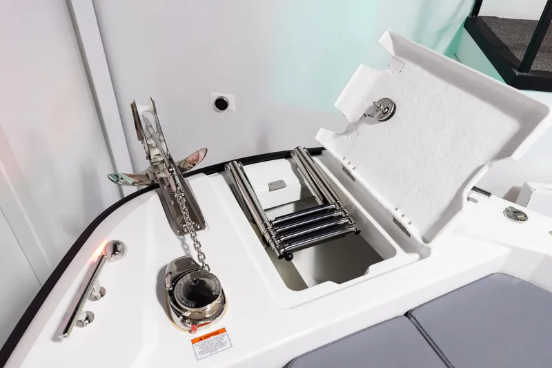Slide: The Image of 2024 Quarken 27 T-Top V2 boat anchor and storage compartment detail. - 26