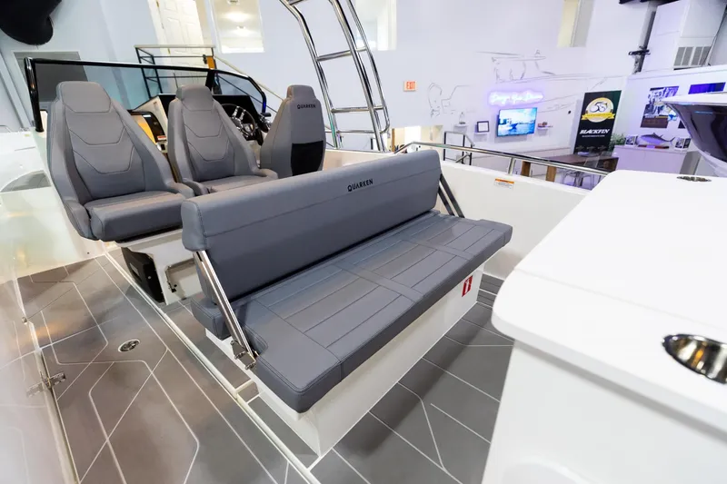 Slide: The Image of 2024 Quarken 27 T-Top V2 boat interior with sleek gray seating and modern design. - 5