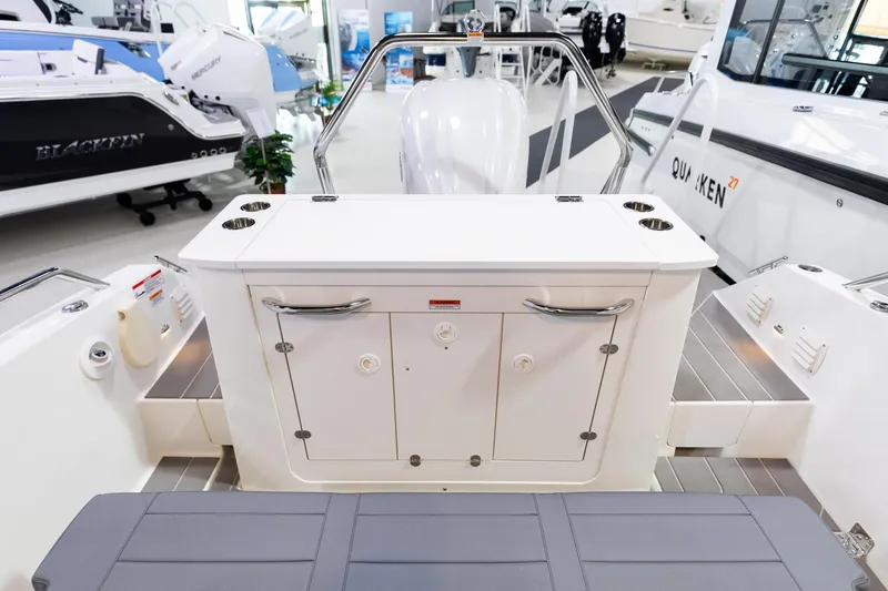 Slide: The Image of 2024 Quarken 27 T-Top V2 boat interior with seating and storage compartments. - 7