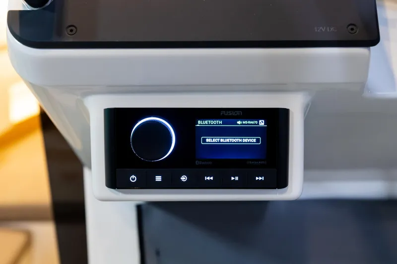 Slide: The Image of Fusion Bluetooth audio system in 2024 Quarken 27 T-Top V2 boat console. - 15