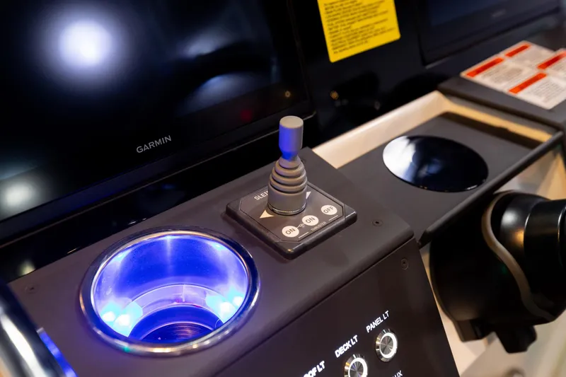 Slide: The Image of Control panel of 2024 Quarken 27 T-Top V2 with joystick and illuminated cup holder. - 16