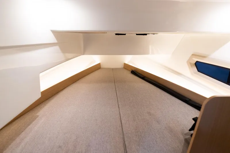 Slide: The Image of Interior cabin of 2024 Quarken 27 T-Top V2 boat, featuring modern design and comfortable seating. - 21