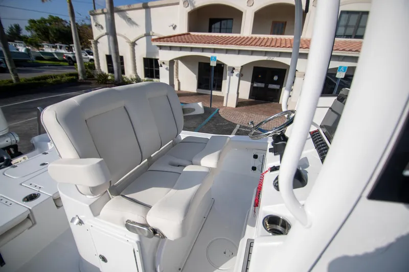 Slide: The Image of 2024 Sea Hunt BX 25 FS boat interior with dual seating and steering console. - 14
