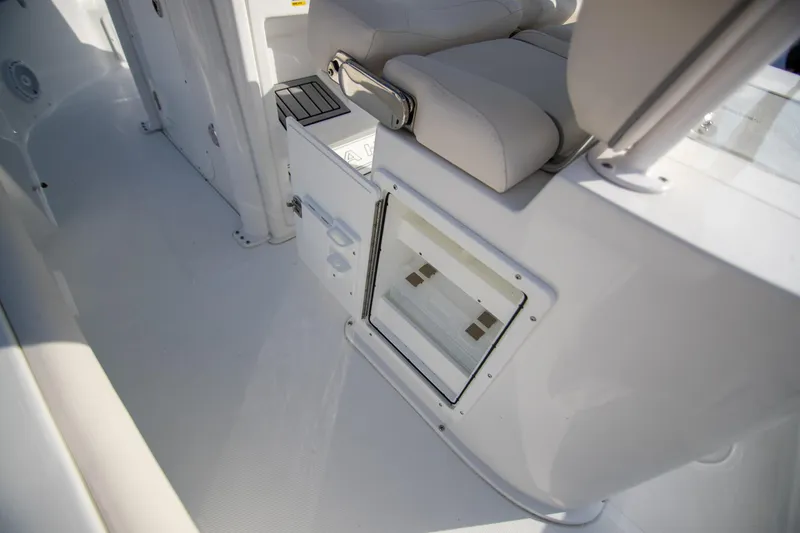 Slide: The Image of 2024 Sea Hunt BX 25 FS boat interior with seating and storage compartment. - 28