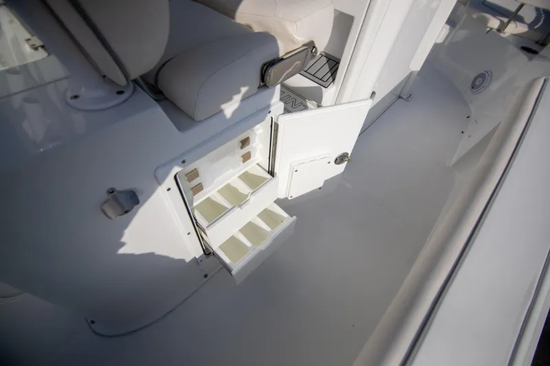Slide: The Image of 2024 Sea Hunt BX 25 FS boat interior storage compartments open. - 29