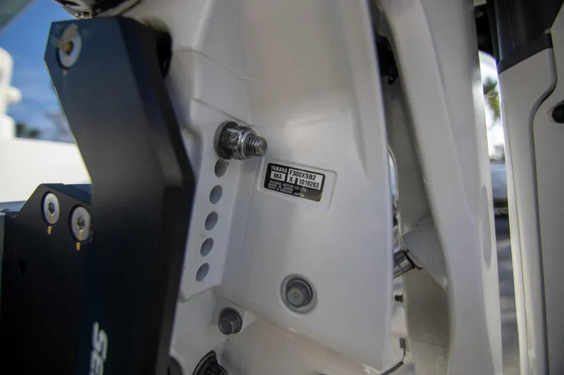 Slide: The Image of Close-up of 2024 Sea Hunt BX 25 FS boat engine details and serial number. - 33