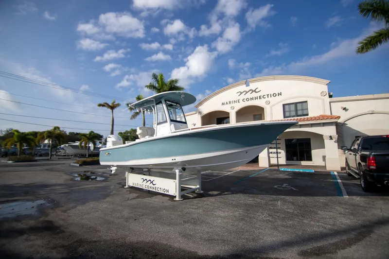 Slide: The Image of 2024 Sea Hunt BX 25 FS boat displayed at Marine Connection dealership. - 4