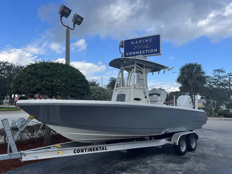 Slide: The Image of 2024 Pathfinder 2400 Open boat on trailer at Marine Connection dealership. - 2