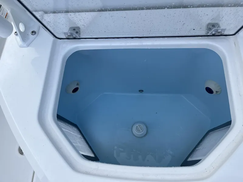 Slide: The Image of 2024 Pathfinder 2400 Open boat livewell, open lid, showing interior details. - 22