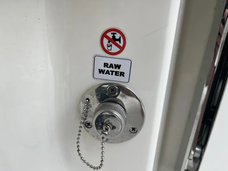 Slide: The Image of 2024 Pathfinder 2400 Open raw water inlet with warning label. - 27