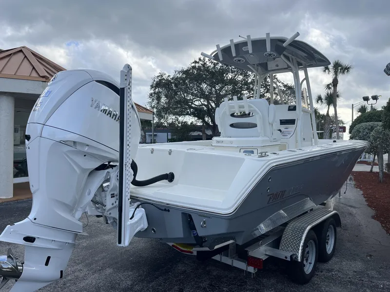 Slide: The Image of 2024 Pathfinder 2400 Open boat with Yamaha engine on a trailer, parked outdoors. - 6