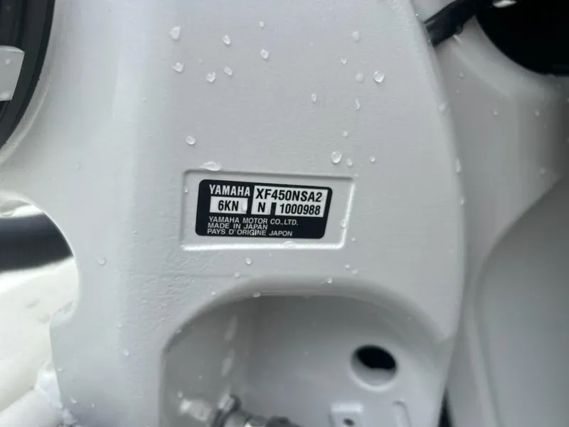 Slide: The Image of Yamaha XF450NSA2 engine label on 2024 Cobia 350 CC boat, wet surface. - 9