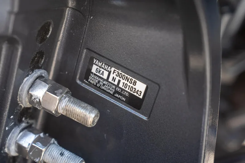 Slide: The Image of Close-up of Yamaha F300NSB engine label on 2024 Cobia 320 CC boat. - 49