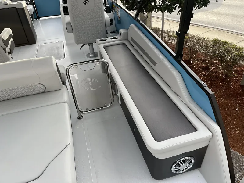 Slide: The Image of 2024 Hurricane FunDeck 2360 SFL OB interior with seating and modern design features. - 12