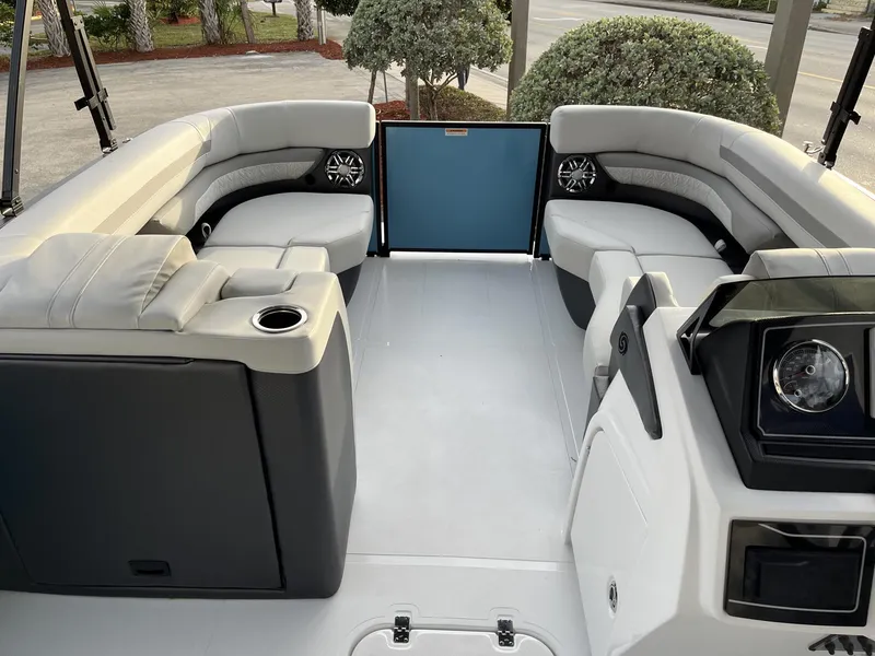 Slide: The Image of 2024 Hurricane FunDeck 2360 SFL OB interior with spacious seating and modern dashboard. - 14