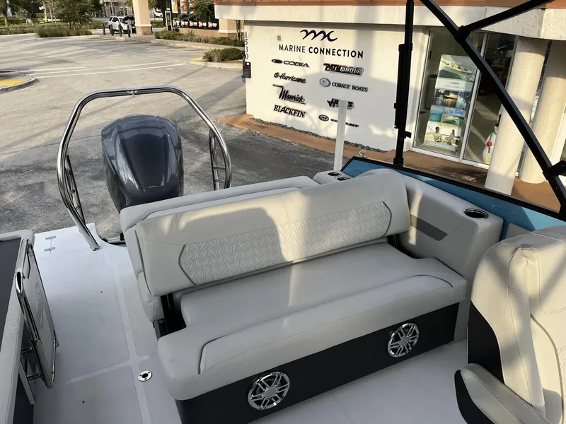 Slide: The Image of 2024 Hurricane FunDeck 2360 SFL OB boat interior with seating and outboard motor. - 20