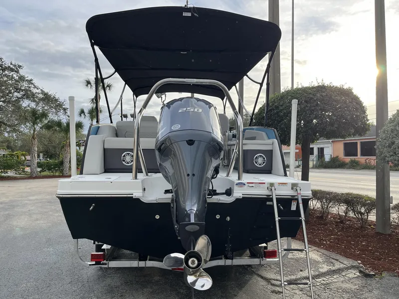 Slide: The Image of 2024 Hurricane FunDeck 2360 SFL OB boat with outboard motor, rear view. - 5