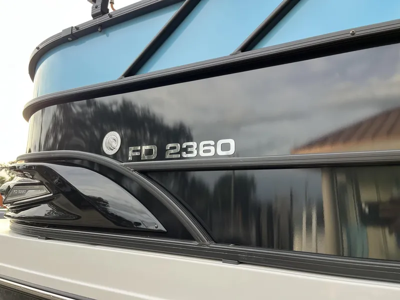 Slide: The Image of 2024 Hurricane FunDeck 2360 SFL OB boat exterior with FD 2360 branding. - 9