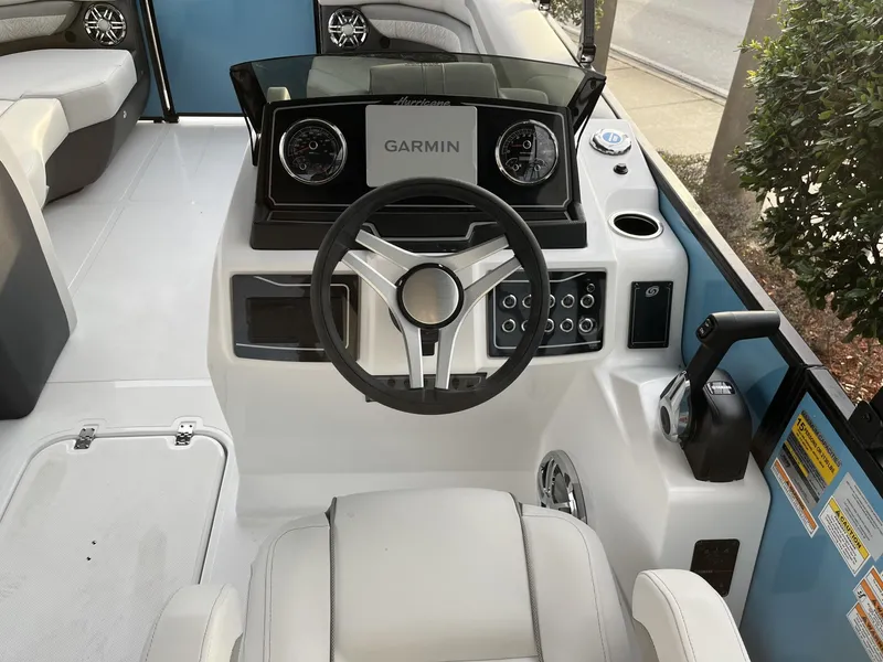 Slide: The Image of 2024 Hurricane FunDeck 2360 SFL OB boat dashboard with Garmin navigation system. - 13