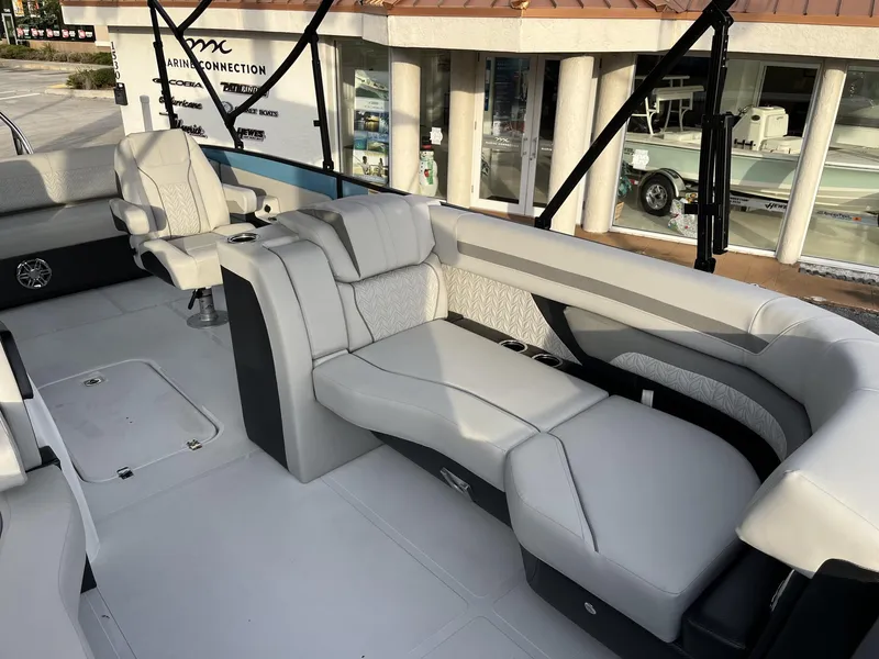 Slide: The Image of 2024 Hurricane FunDeck 2360 SFL OB interior with luxurious seating and modern design. - 17