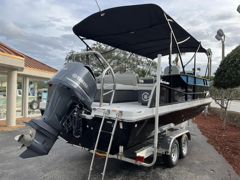 Slide: The Image of 2024 Hurricane FunDeck 2360 SFL OB boat with Yamaha outboard motor on trailer. - 6