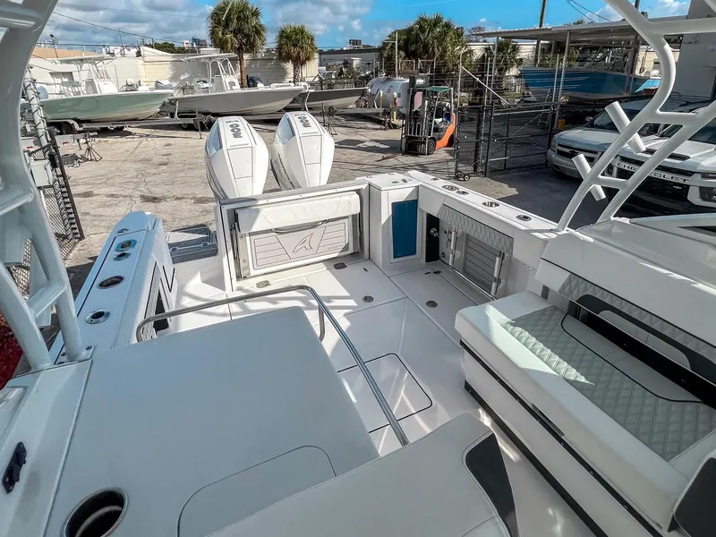 Slide: The Image of 2024 Blackfin 272DC boat interior with dual engines, spacious seating, and modern design. - 10