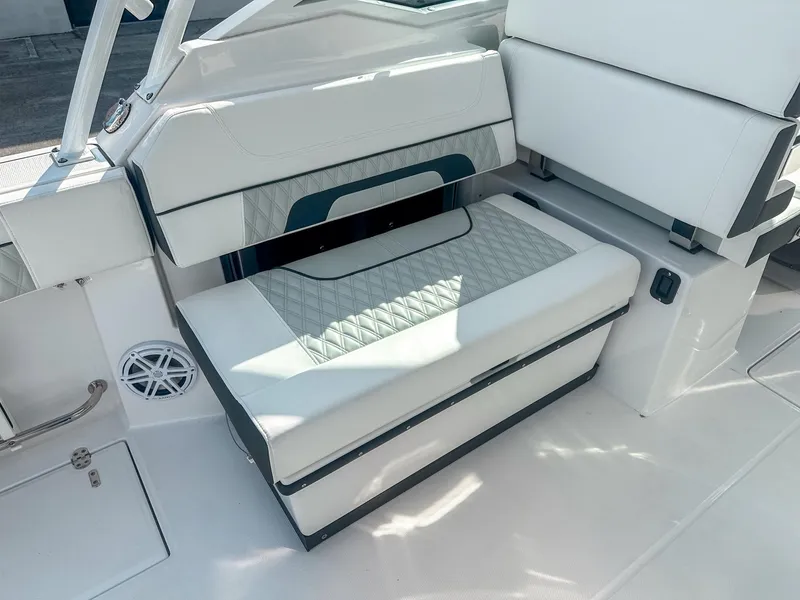Slide: The Image of 2024 Blackfin 272DC boat interior seating with quilted upholstery and modern design. - 14