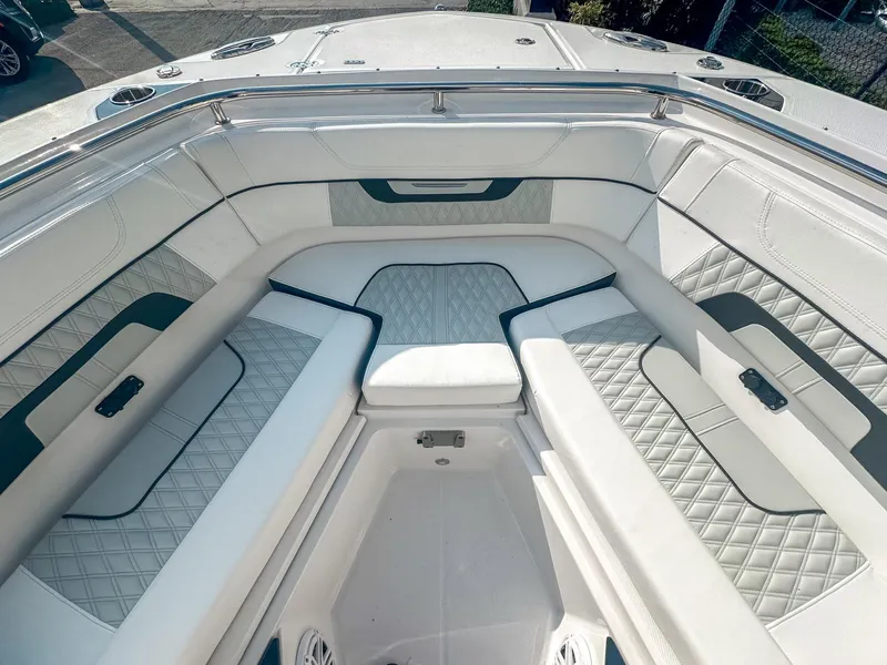 Slide: The Image of 2024 Blackfin 272DC boat interior with luxurious seating and diamond-patterned upholstery. - 21