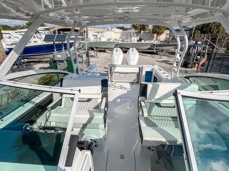 Slide: The Image of 2024 Blackfin 272DC boat interior with modern seating and dual outboard engines. - 9