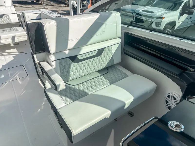 Slide: The Image of 2024 Blackfin 272DC boat interior with luxurious seating and modern design. - 18