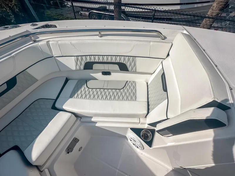 Slide: The Image of 2024 Blackfin 272DC boat interior with luxurious white seating and modern design. - 22