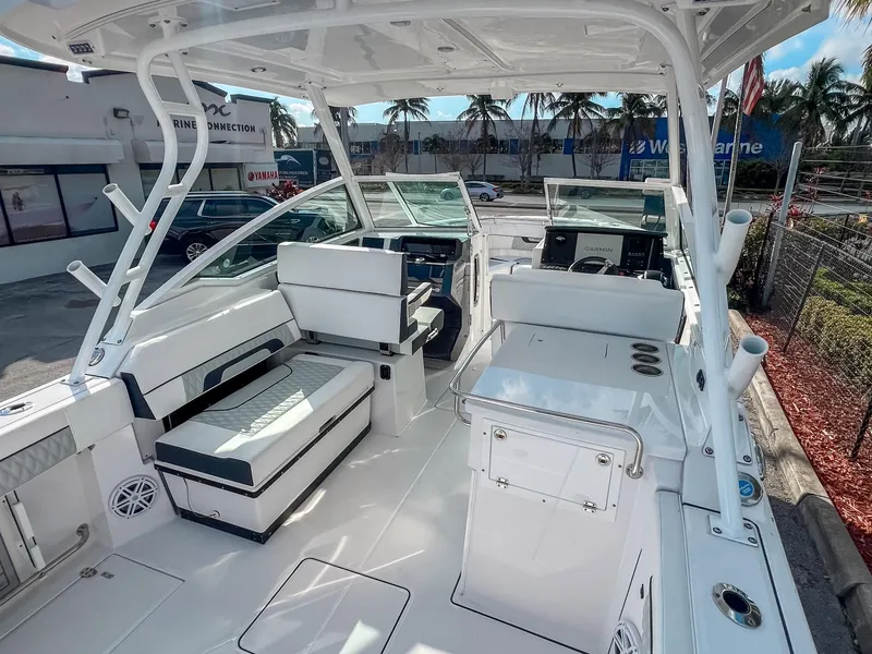 Slide: The Image of 2024 Blackfin 272DC boat interior with seating and navigation equipment. - 6