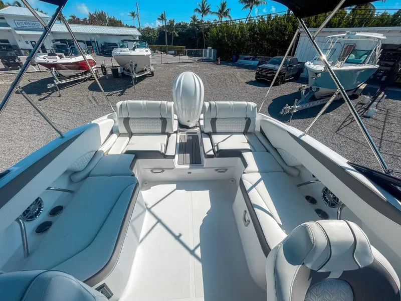 Slide: The Image of 2024 Hurricane SunDeck 2600 OB boat interior with spacious seating and modern design. - 19