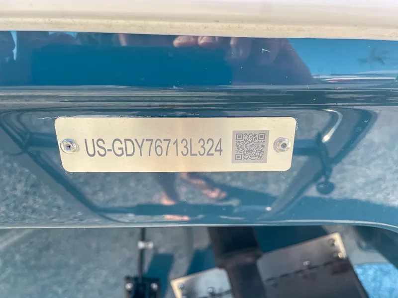 Slide: The Image of 2024 Hurricane SunDeck 2600 OB boat identification plate with QR code and serial number. - 22