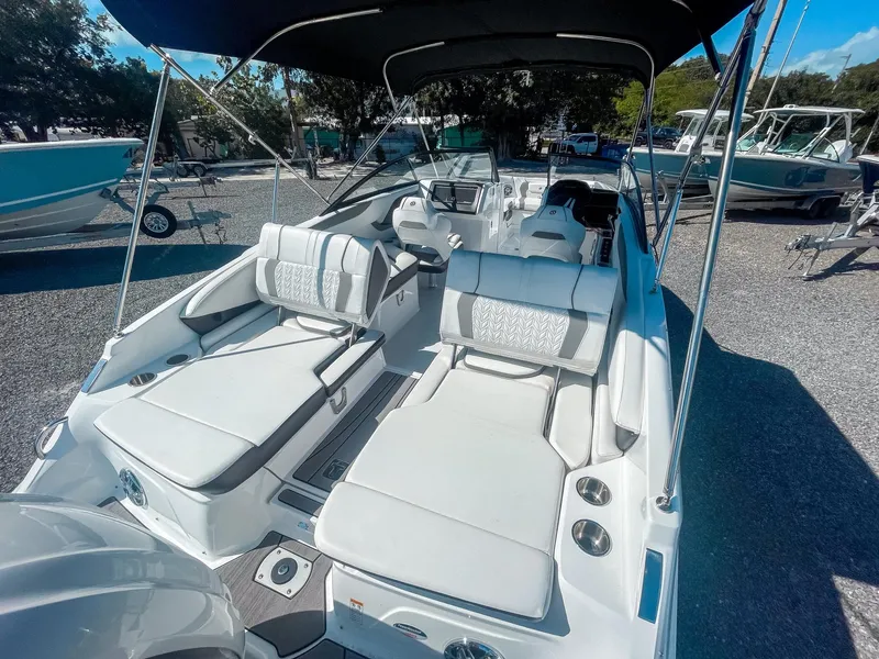 Slide: The Image of 2024 Hurricane SunDeck 2600 OB boat with spacious seating and sleek design. - 8