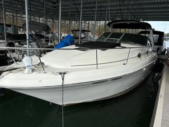 The Image of 2000 Sea Ray 340 Sundancer docked in a covered marina. - 0