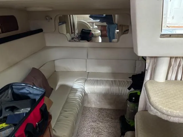 Slide: The Image of Interior of 2000 Sea Ray 340 Sundancer yacht with beige seating and carpet. - 13