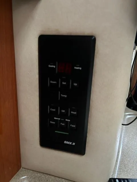 Slide: The Image of Control panel on a 2000 Sea Ray 340 Sundancer boat, featuring SMX II system. - 20