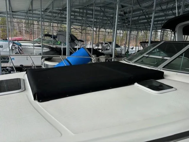 Slide: The Image of 2000 Sea Ray 340 Sundancer docked in a covered marina. - 4